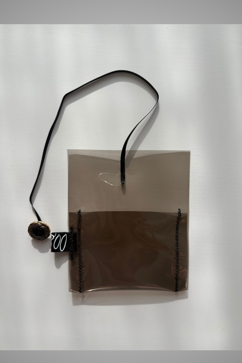 clear supersmall case with ribbon and button