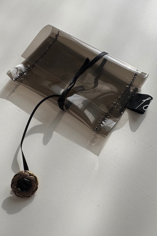 clear supersmall case with ribbon and button