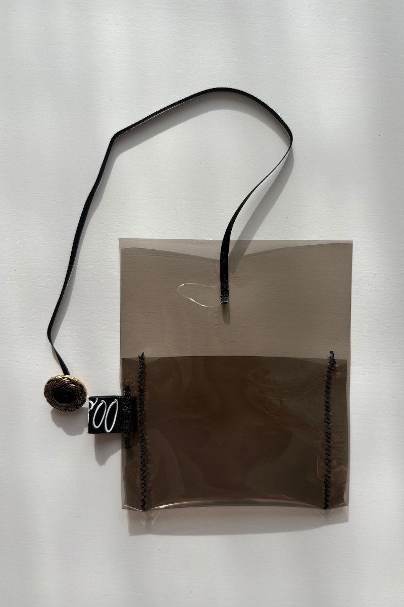 clear supersmall case with ribbon and button